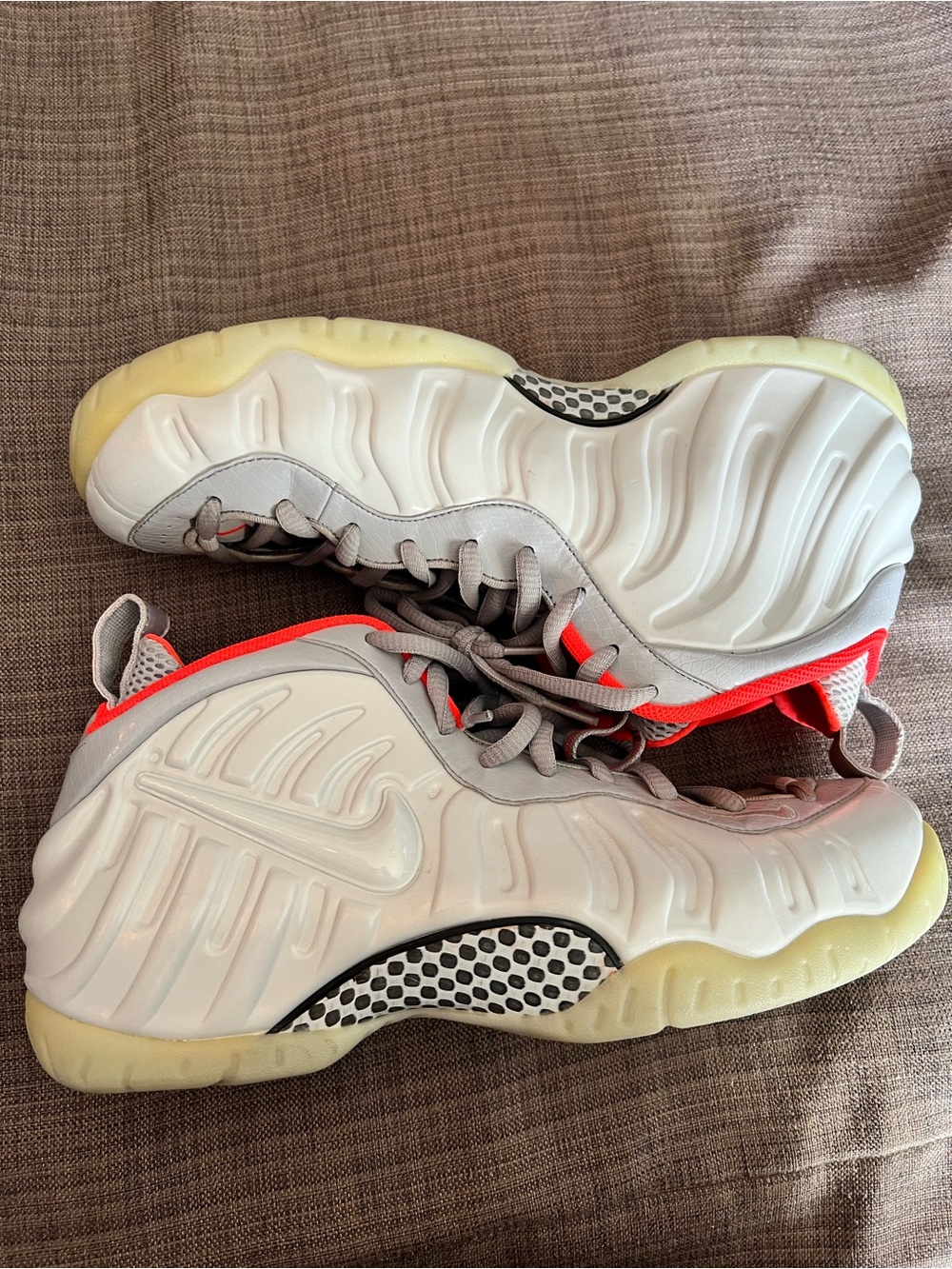 Nike white and Neon Coral Foamposite Sneakers